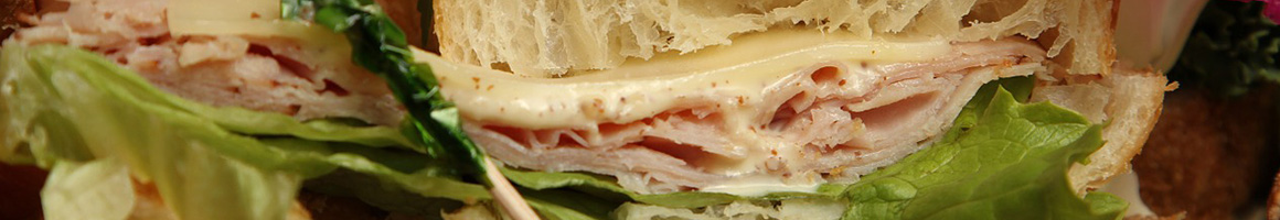 Eating American (Traditional) Sandwich at Delco's Original Steaks restaurant in Dunedin, FL.